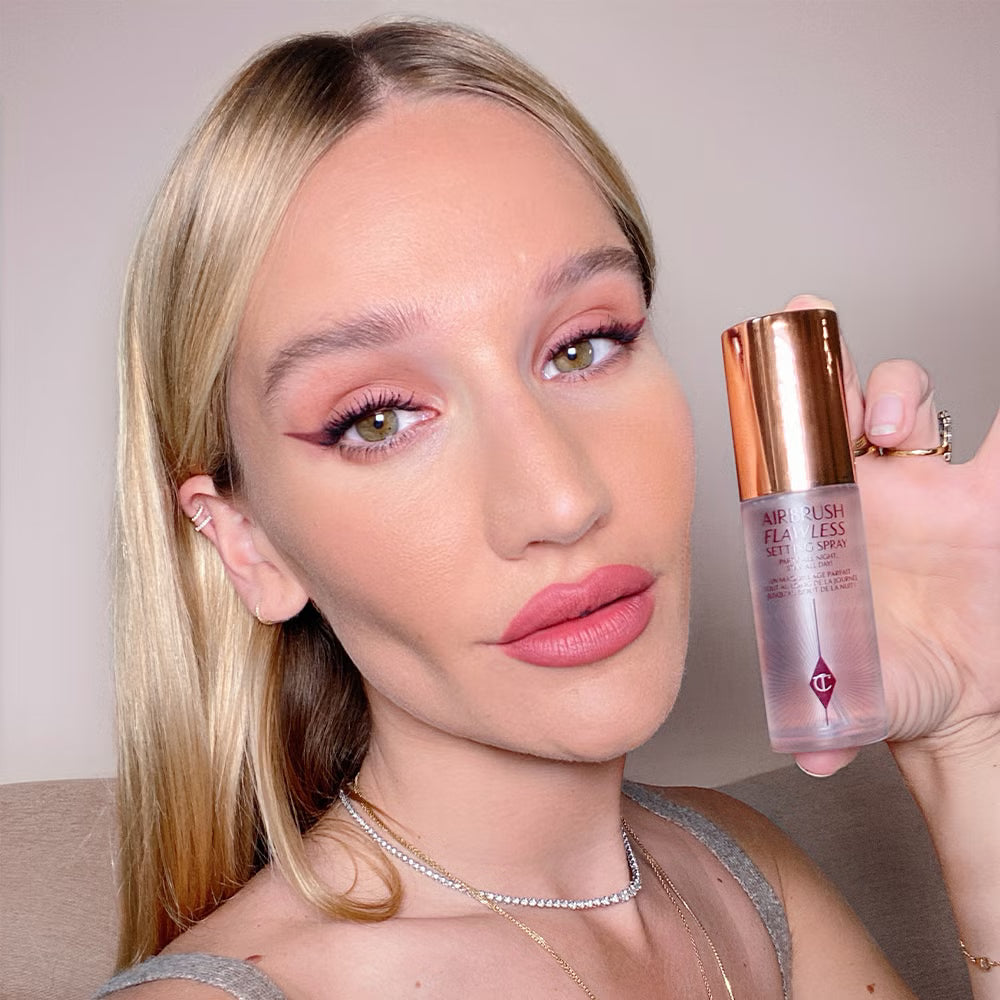 Charlotte Tilbury Airbrush Setting Spray in hand — airbrush finish makeup fixer